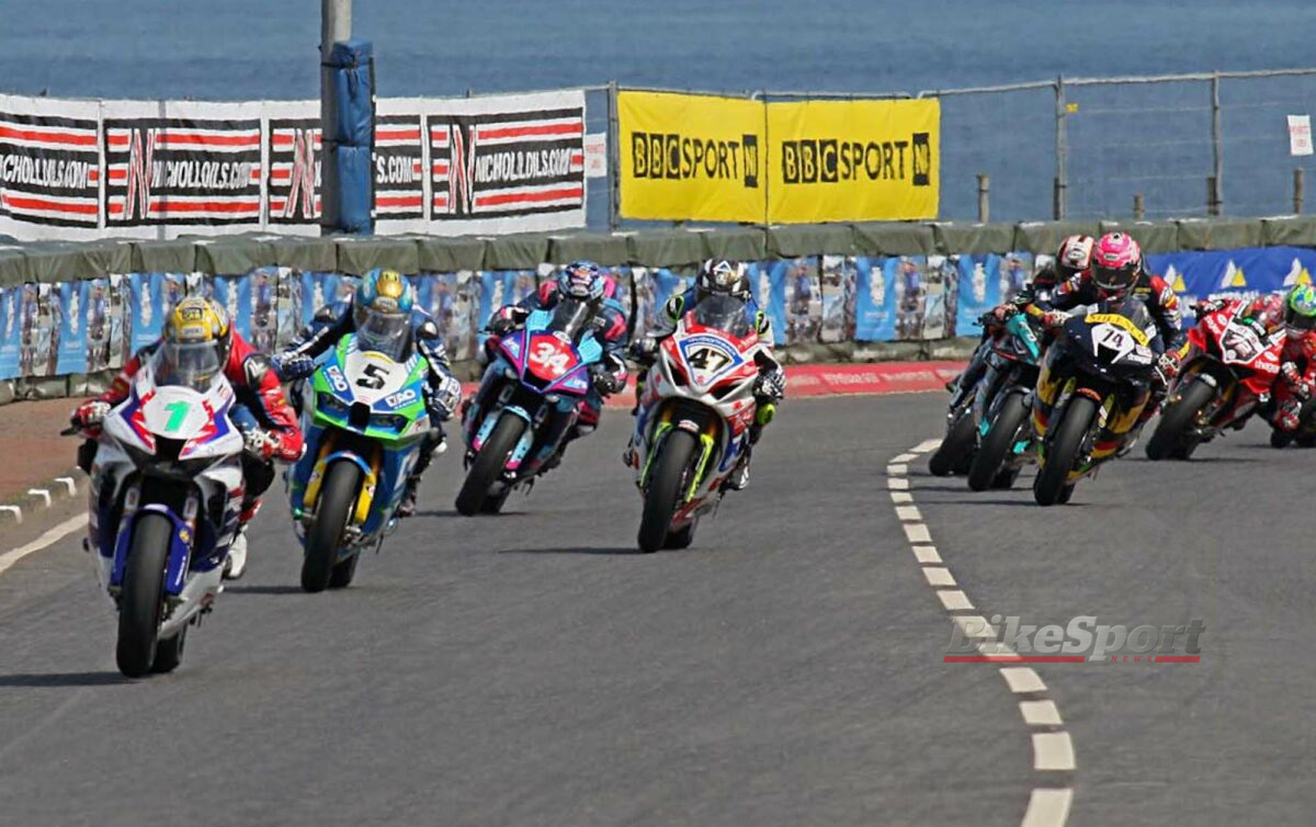 Glenn Irwin leads on the opening lap of the Anchor Bar Superbike race at the NW200. Photo Rod Neill, action, start, group, pack